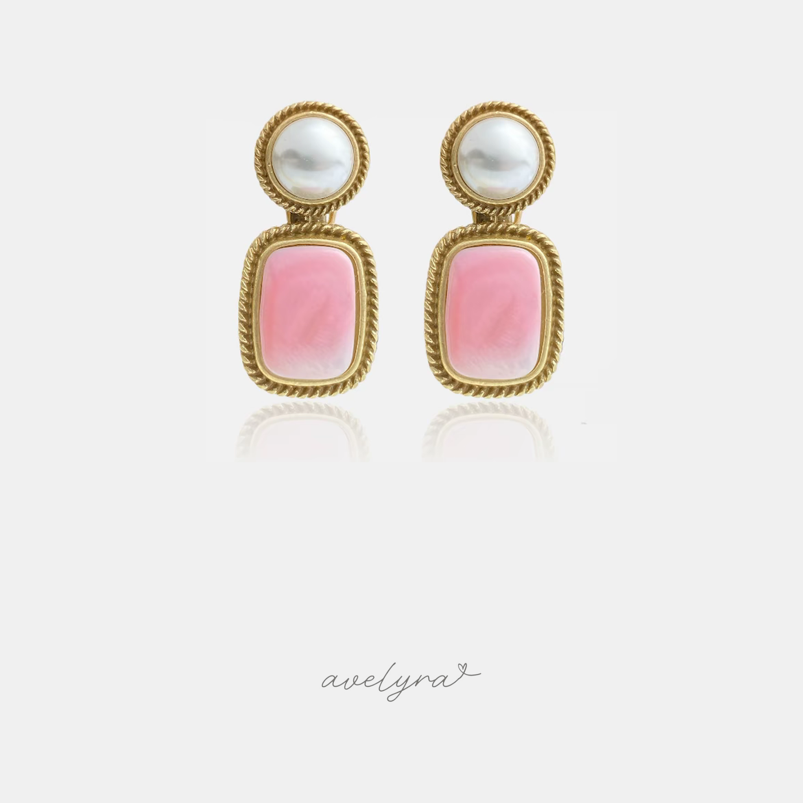 Gold-tone drop earrings with a round pearl top and a rectangular pink stone, both in twisted rope frames.