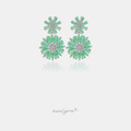 Silver-tone drop earrings with two mint-green marquise-cut flowers around pave centers.