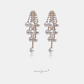 Long drop earrings with cascading white pearls set among sparkling crystal strands.