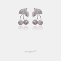 Silver-tone earrings with a pave leaf above two pink pave cherries on curved stems.