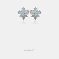 Silver-tone cluster stud earrings with iridescent white oval stones and clear crystal accents.