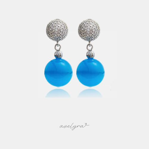 Silver-tone pave stud earrings with a glossy blue round bead drop.