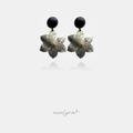 Black round stud earrings with carved iridescent shell flower drops.