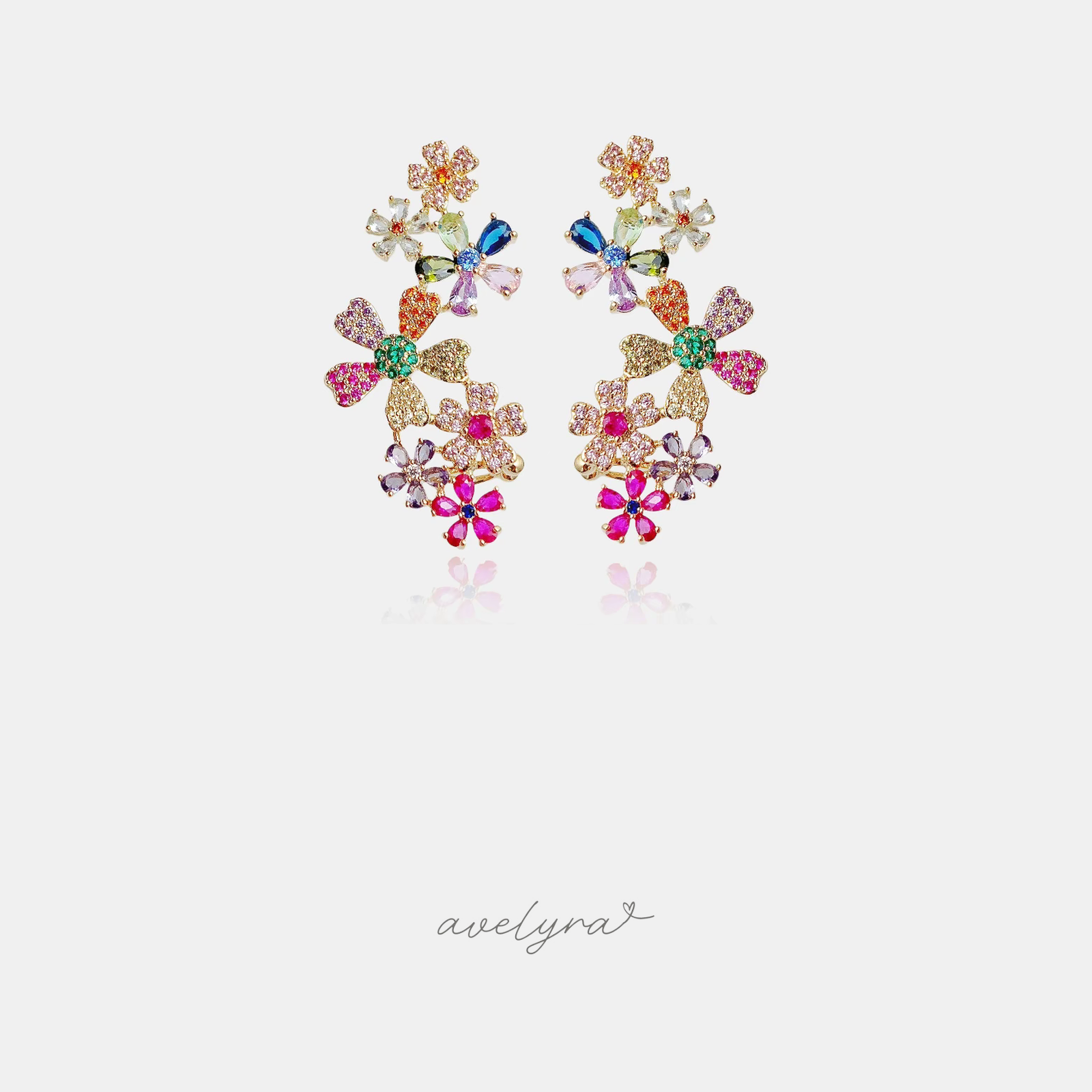 Gold-tone cluster earrings made of many small flowers set with pink, green, blue, purple, orange and red crystals.