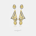 Gold-tone chandelier earrings with yellow stones outlined by rows of blue stones.