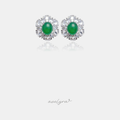 Pair of silver-tone flower stud earrings with a green oval centre stone surrounded by clear faceted petal stones.