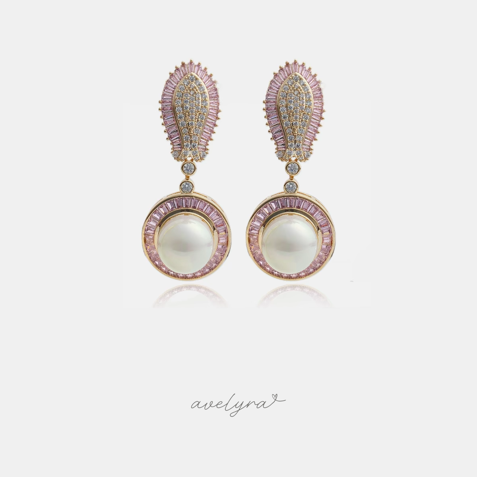 Gold-tone earrings with pink baguette paisley tops and round pearls framed by pink stones.